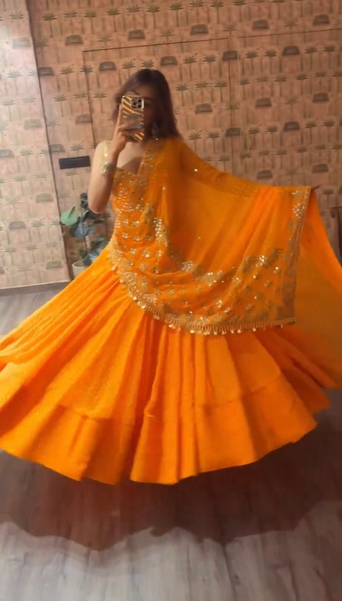 Orange Printed Faux Georgette Lehenga Set
