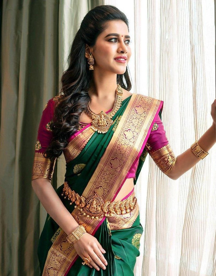 Extravagant green soft silk saree with a classy blouse piece
