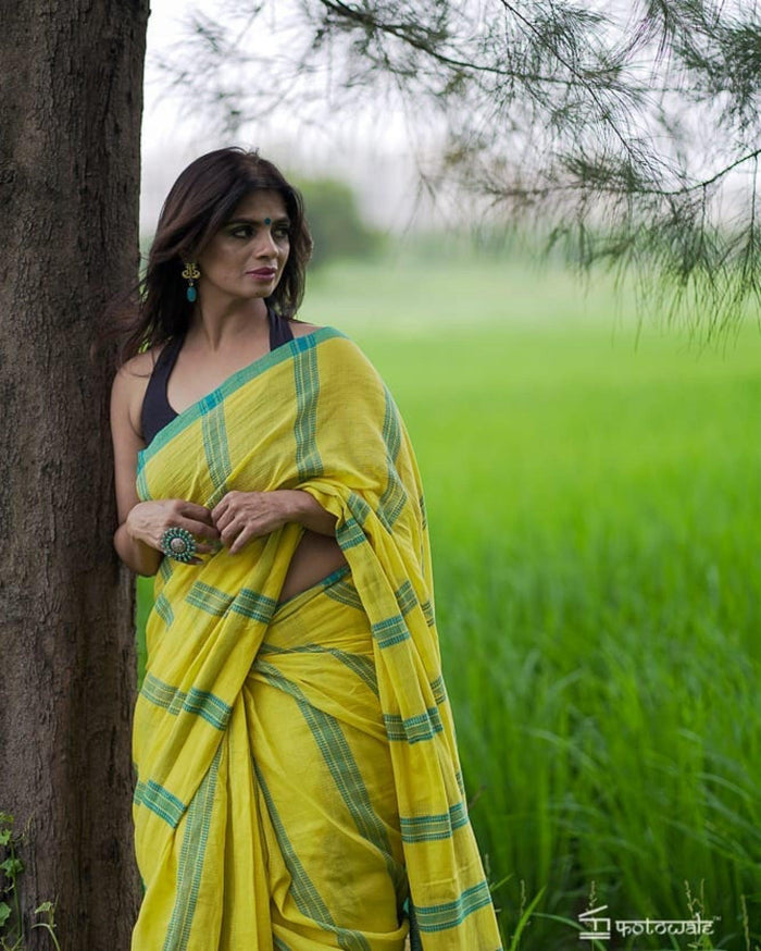 Adorning Yellow color Linen Designer Embroidered Saree
